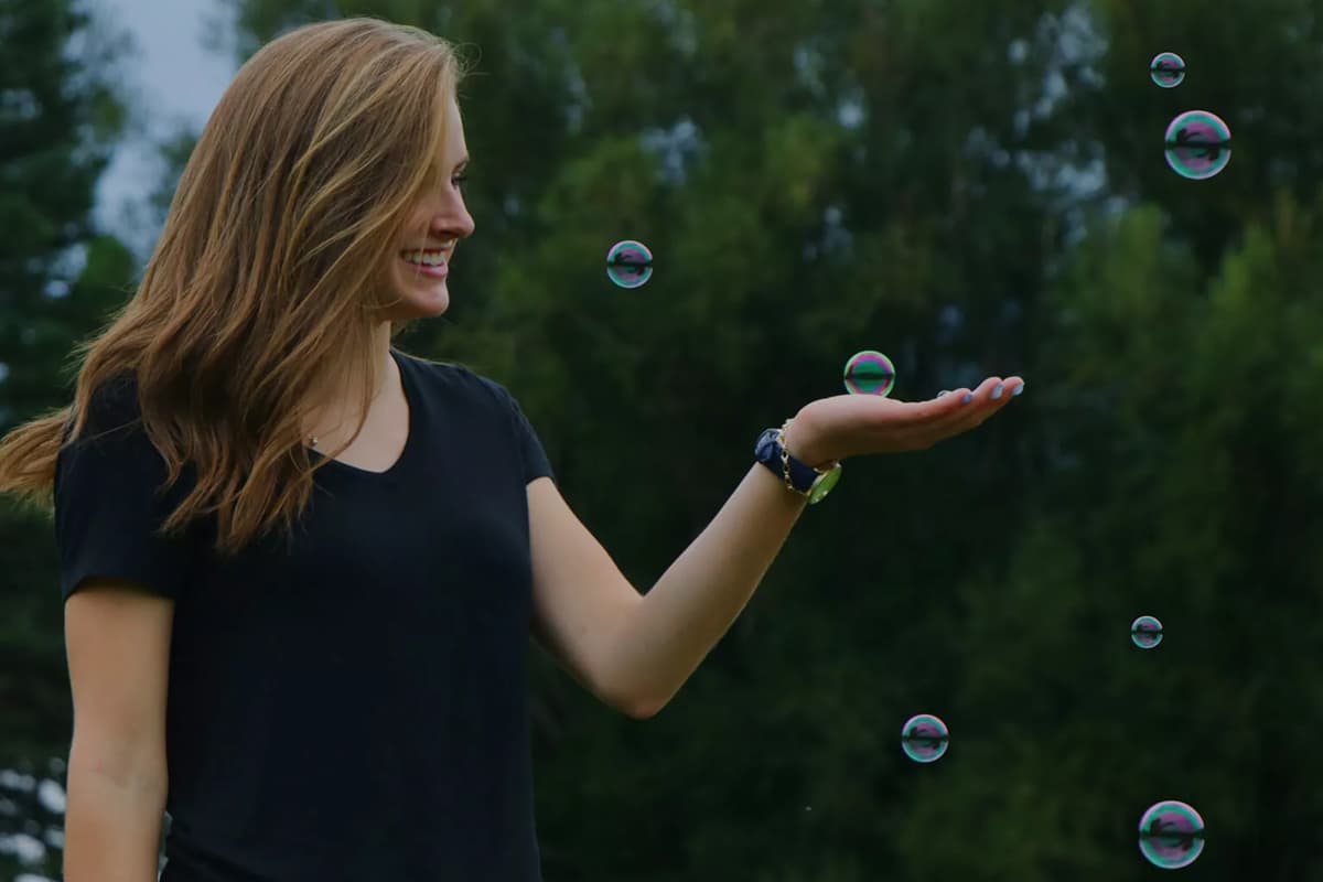 woman holding bubbles