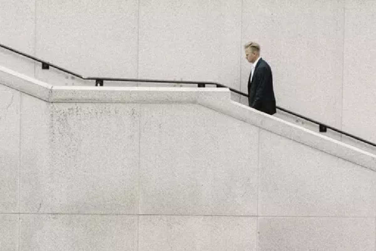 man walking up steps