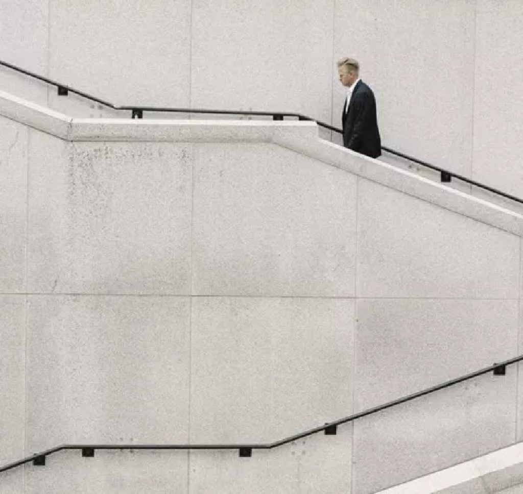 man walking up steps