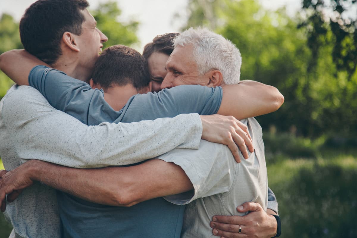 four people hugging