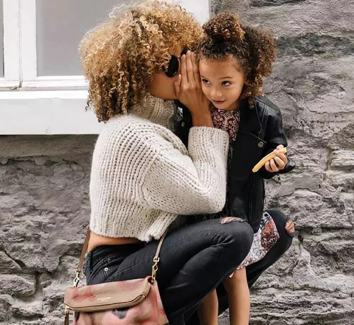 usp-harris woman whispering to a child