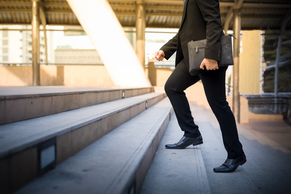 man walking up steps