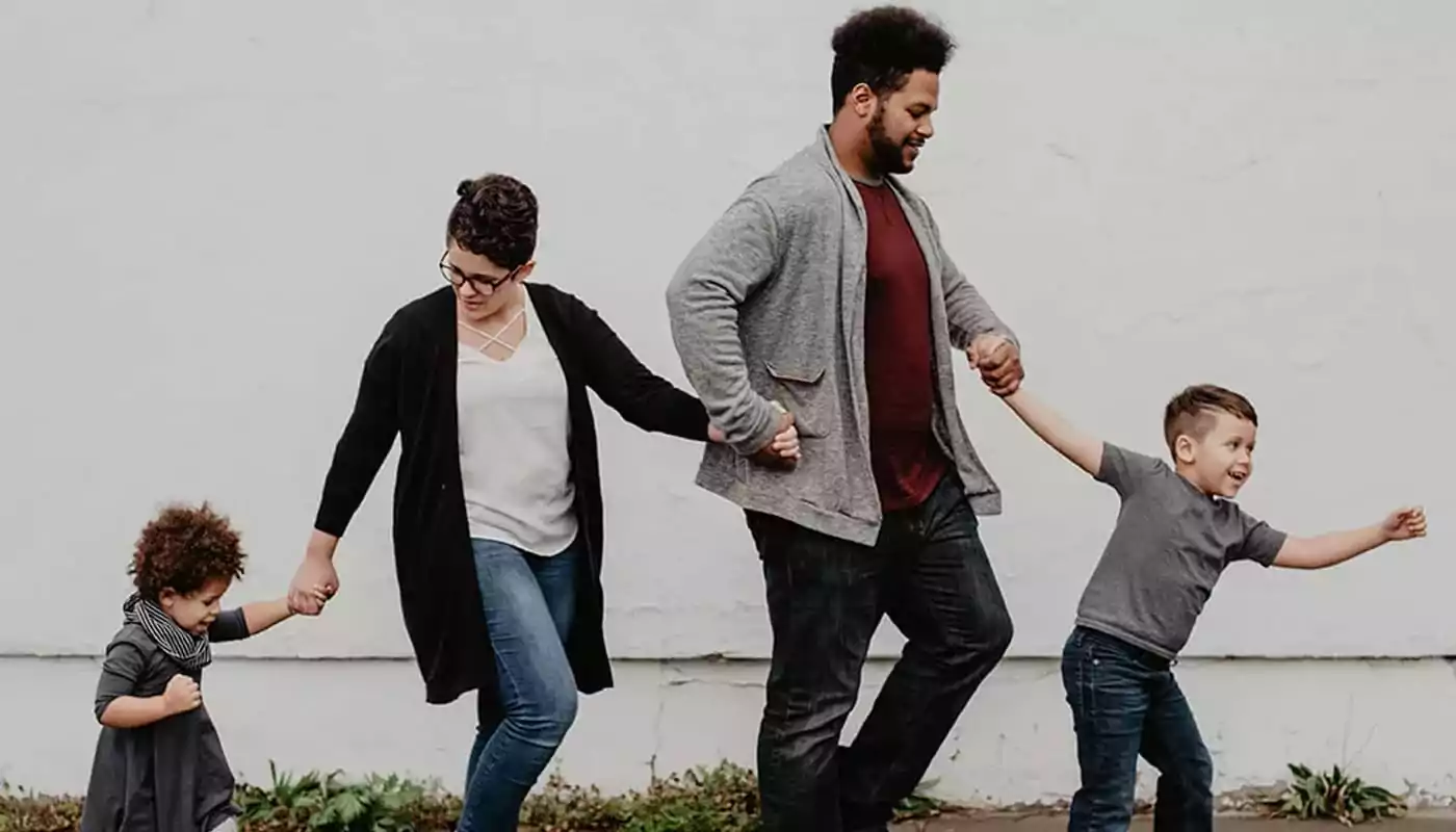 a family holding hands