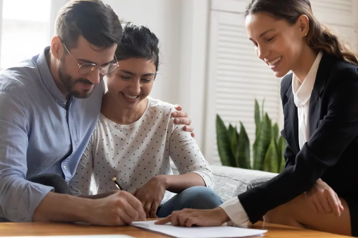 consumer-proposal couple signing a piece of paper