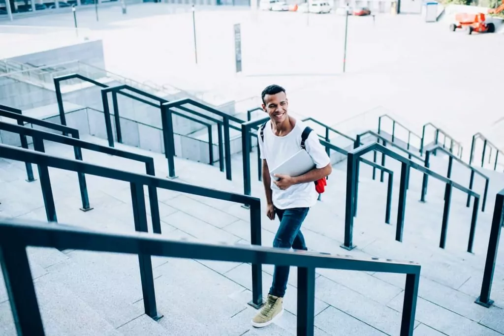 man walking up steps