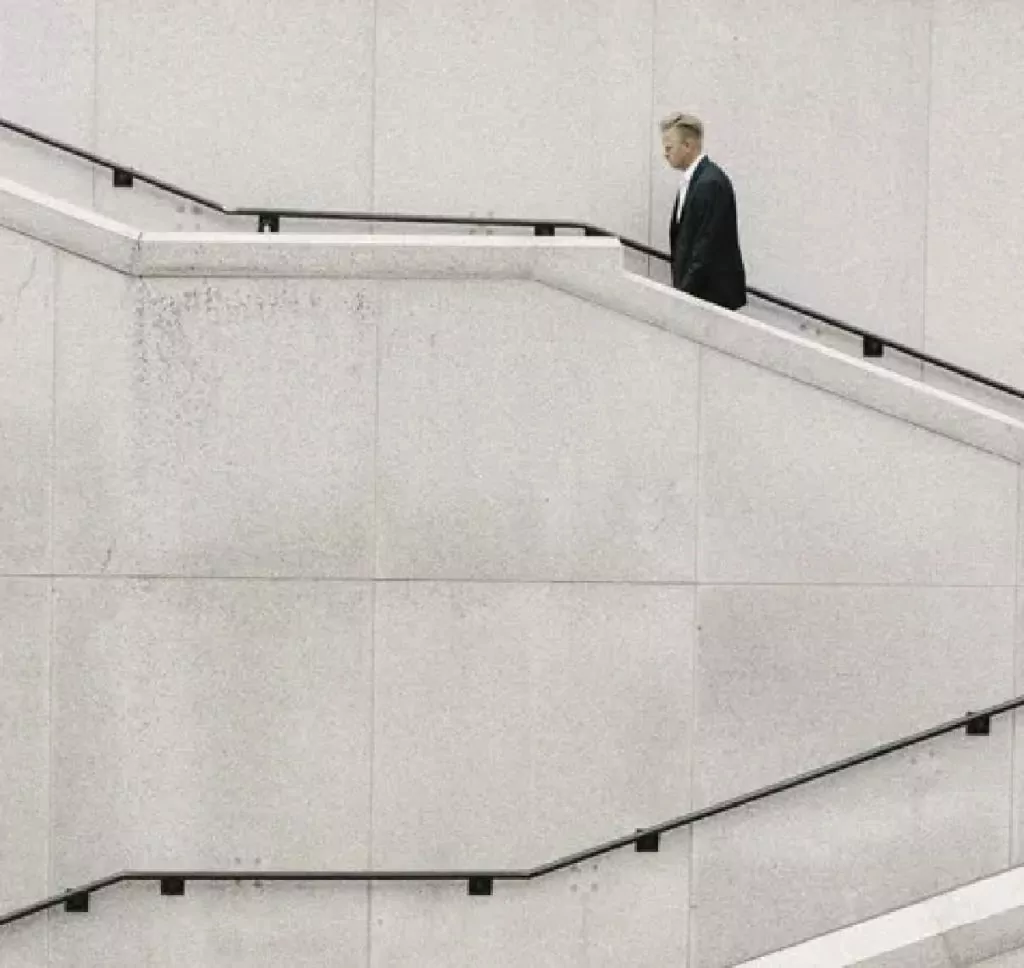 man walking up steps