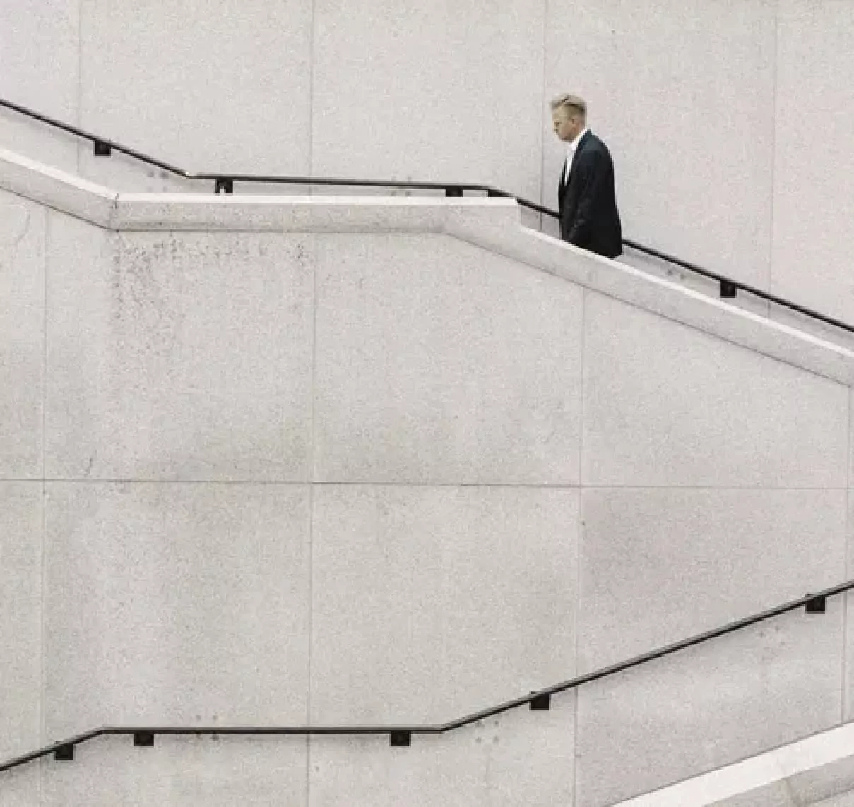 man walking up steps