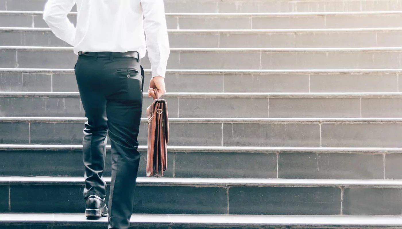 man walking up steps