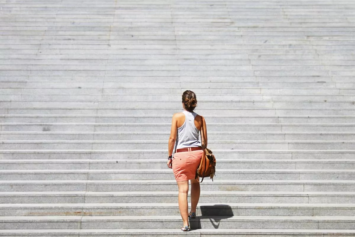 woman walking up stairs